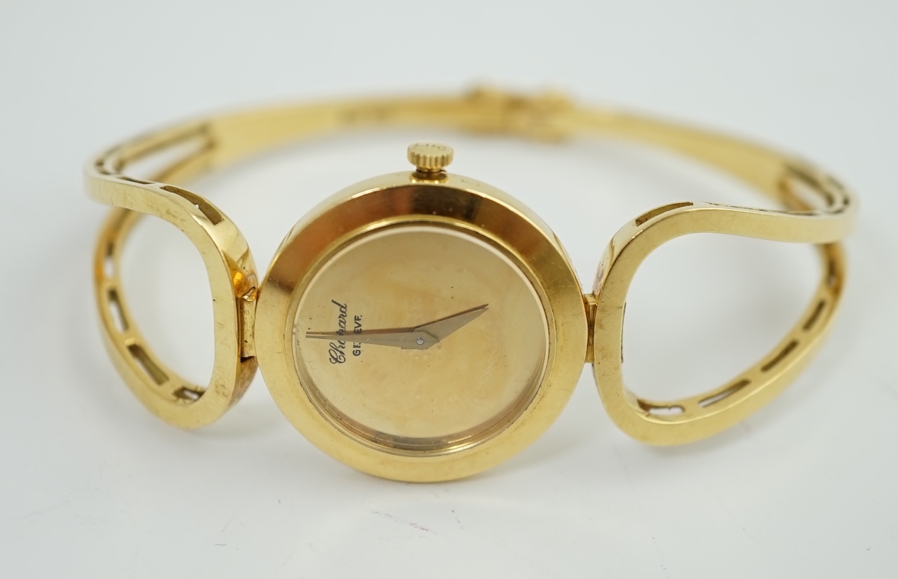 A lady's 18k gold Swiss Chopard manual wind hinged bangle wrist watch